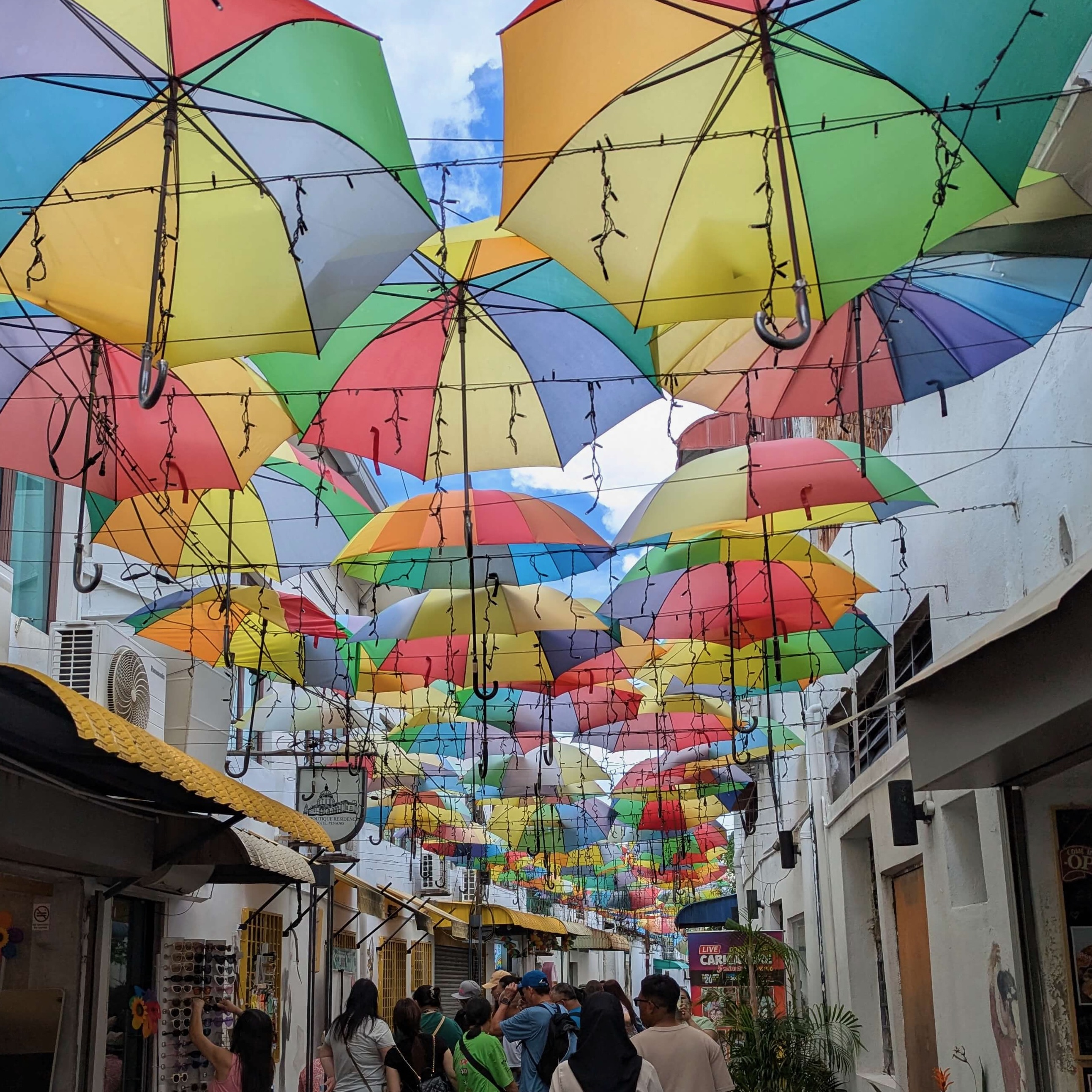 Georgetown Armenian Street with vendors and street art.